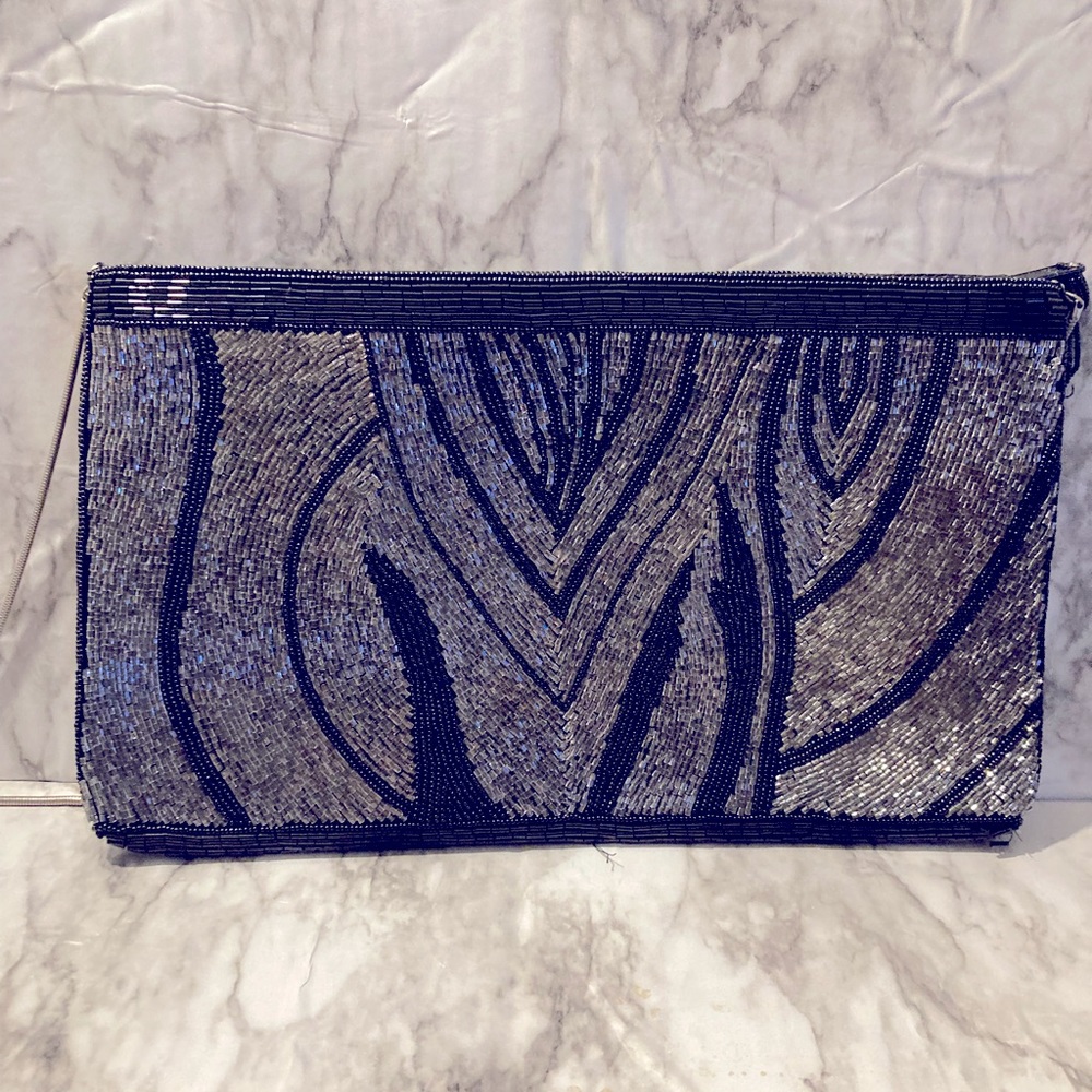 Black and silver beaded bag with a long strap,